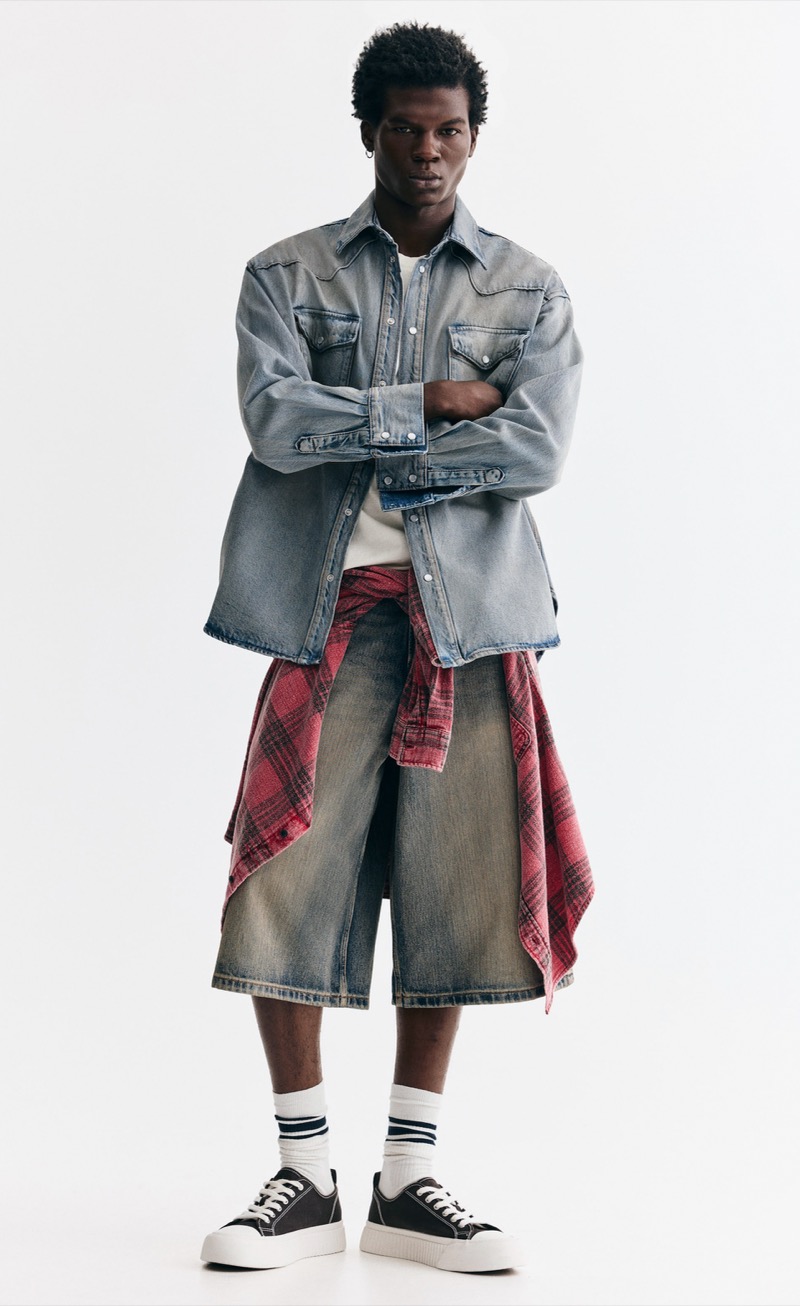 oversized faded denim shirt with wide-leg denim shorts and flannel tied at waist outfit for men