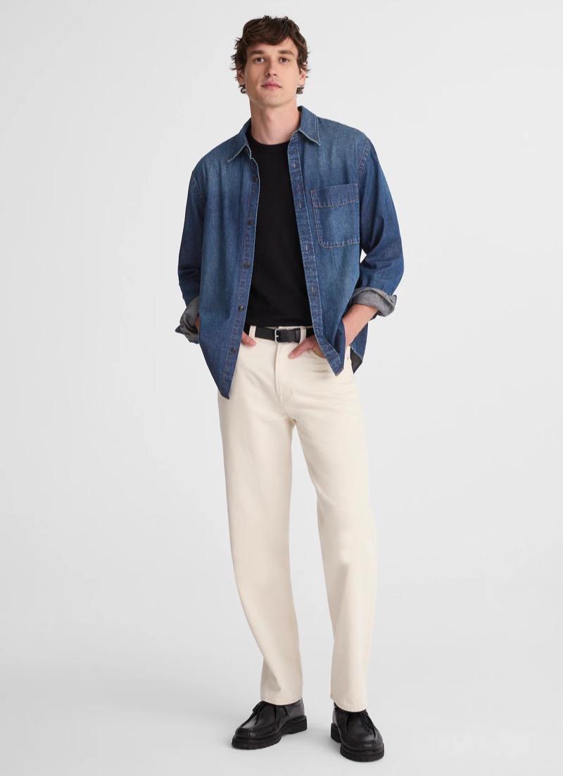 blue denim shirt worn open over black tee with ecru jeans and black derby shoes