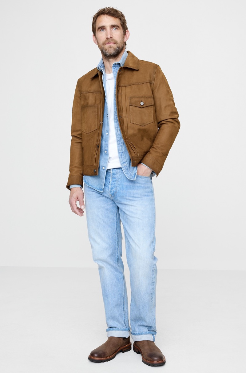 light blue denim shirt under tan suede trucker jacket with light wash jeans and brown boots