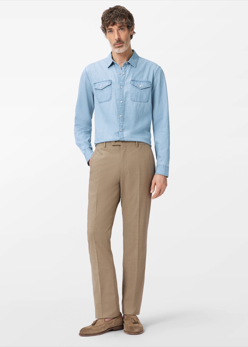 light blue western denim shirt tucked into khaki trousers with suede loafers
