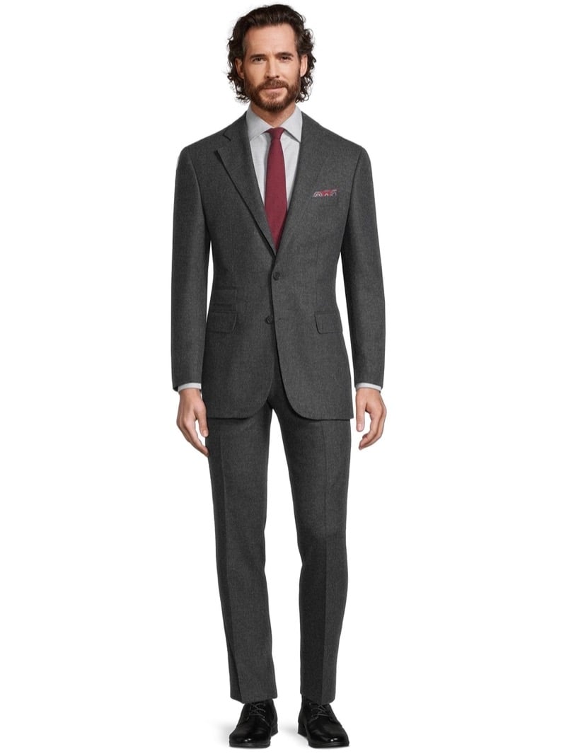 Model wears a custom gray suit