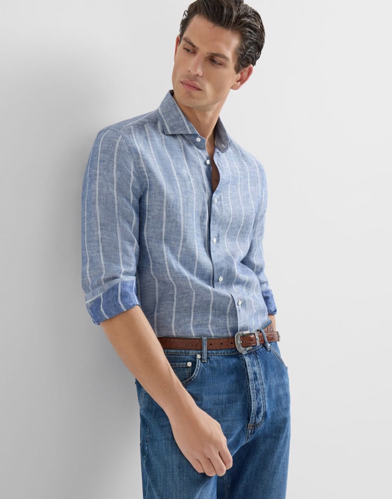man wearing striped linen shirt with sleeves rolled using the Italian roll method, cuff visible as the outermost layer