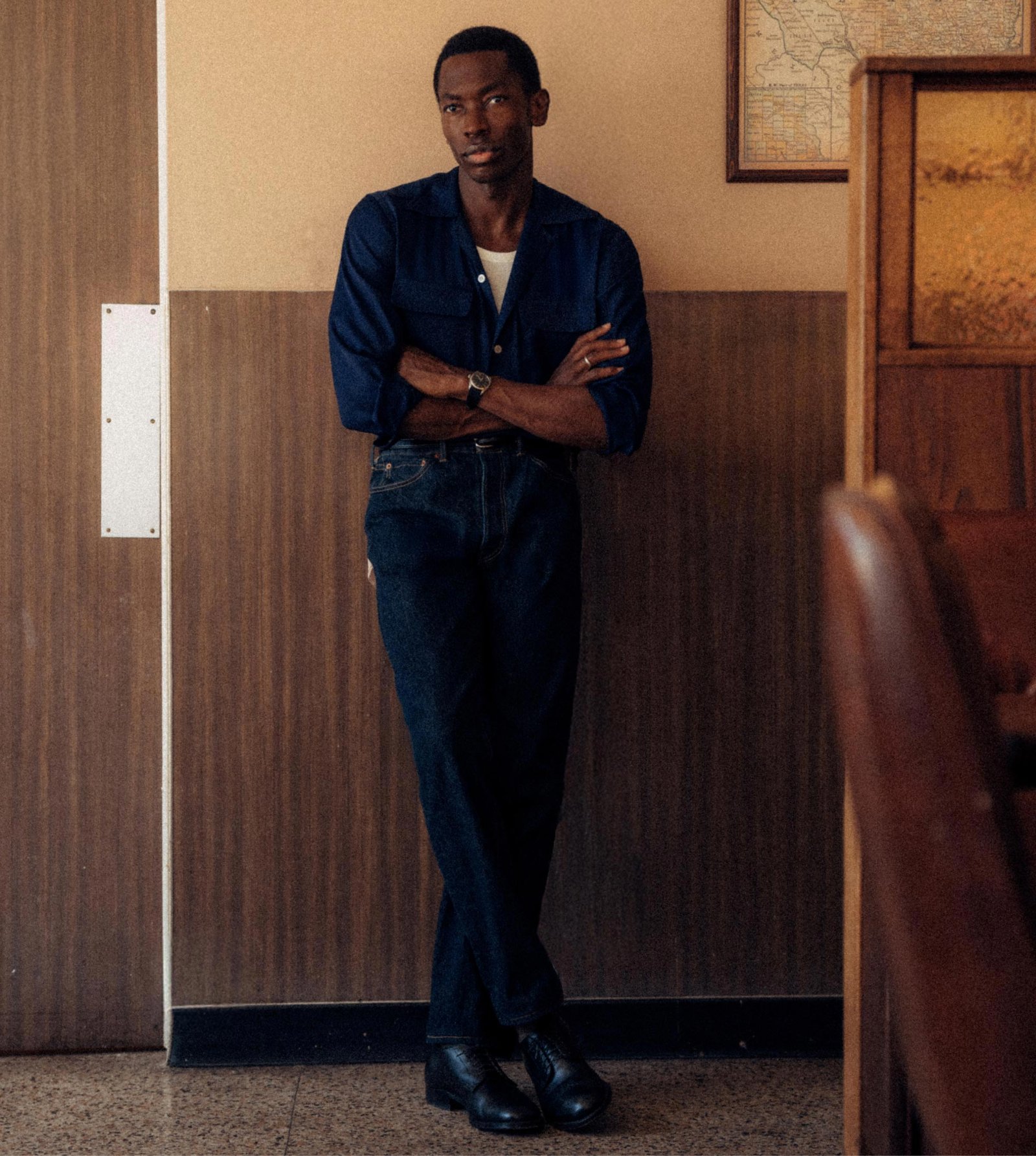 The navy camp shirt sits close in color to dark denim.