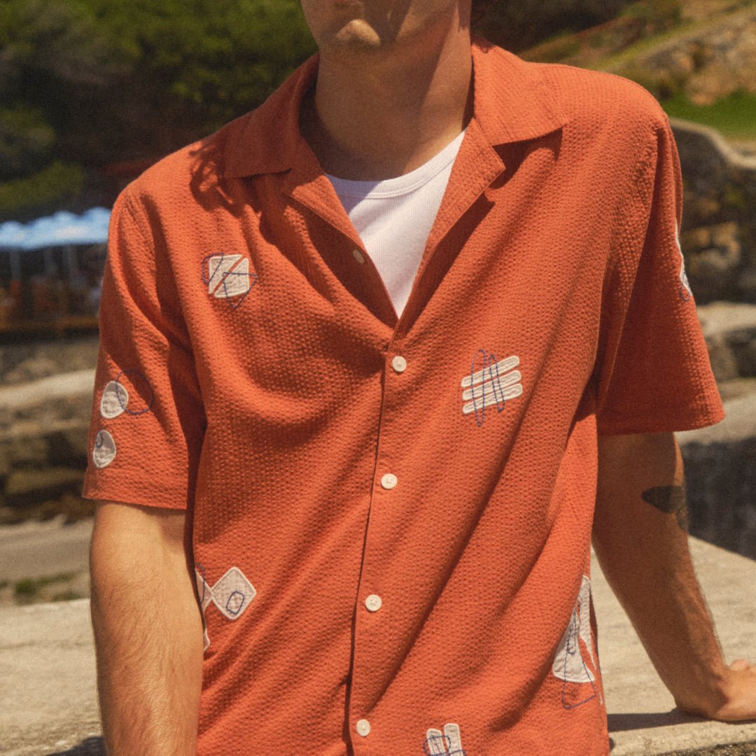 The terracotta Didcot shirt opens over a white ribbed vest.