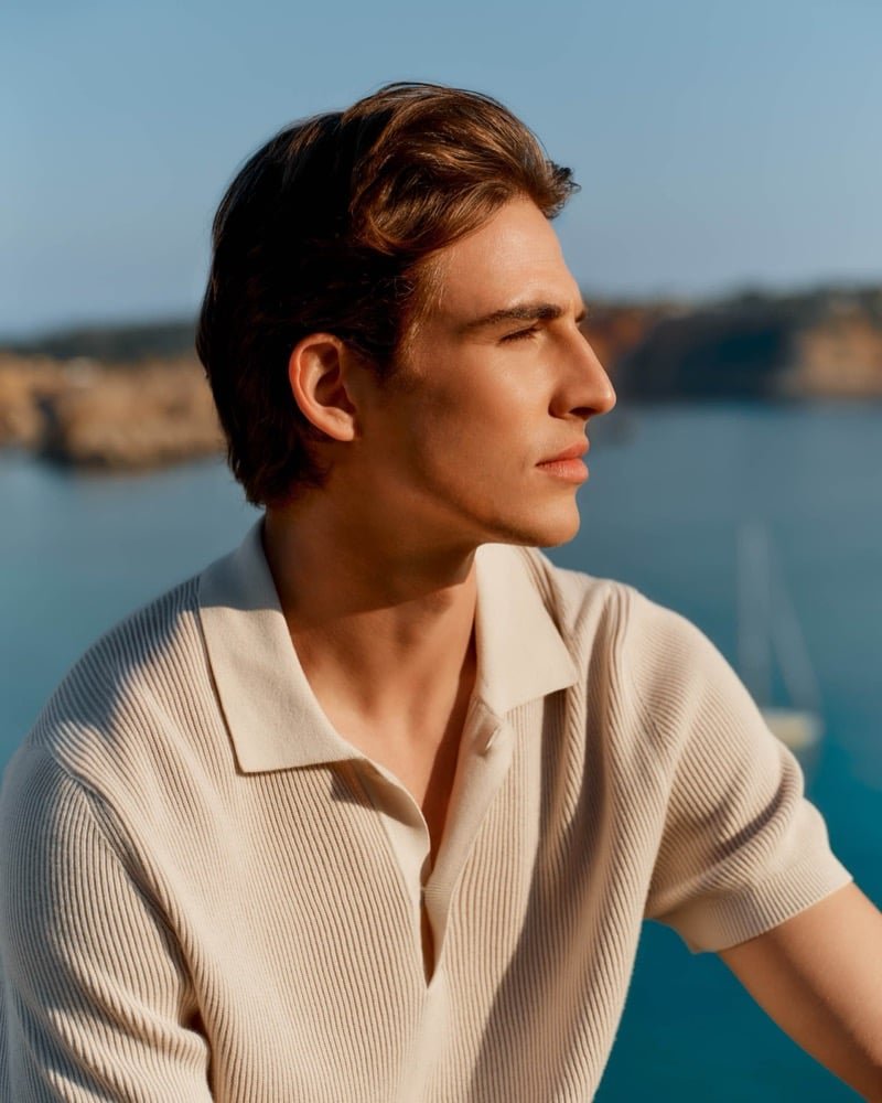A cream ribbed polo brings texture to the coastal setting.